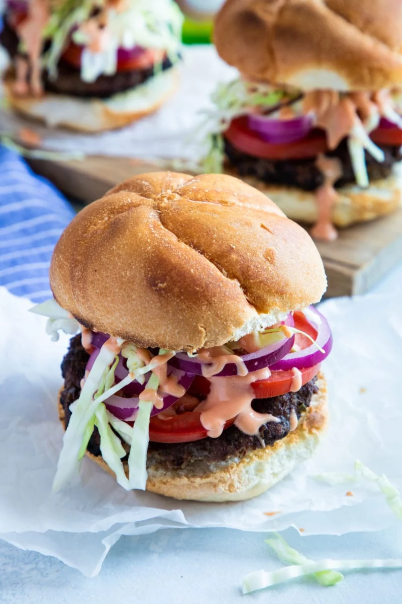 The Original Juan Burger with cabbage, tomato and pink sauce