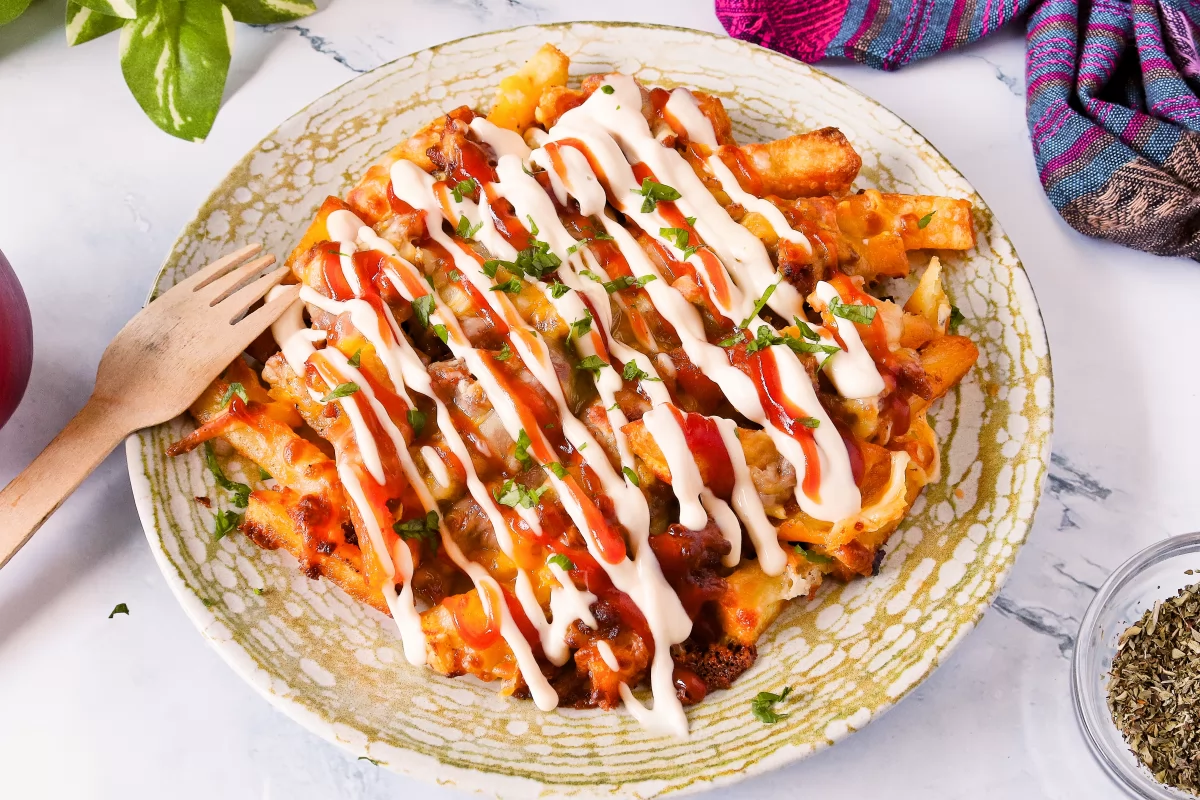 Chimi Yaroa — fries layered with meat, melted cheese, ketchup and mayo