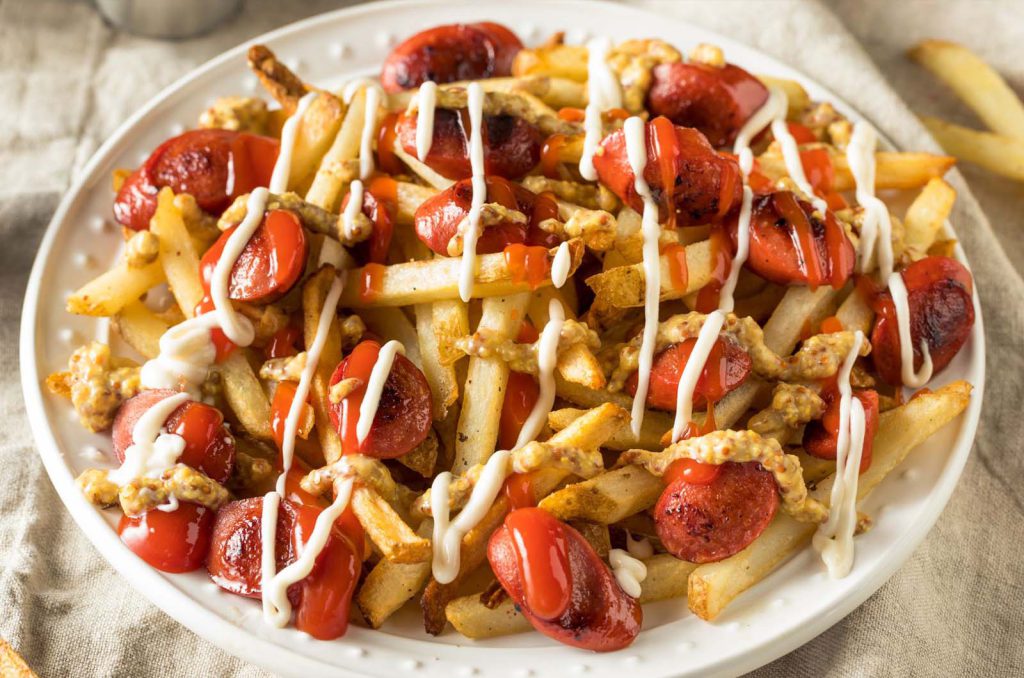 Salchi-Papas — fries with sliced sausage, ketchup and mayo